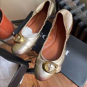 Flat gold coach shoes